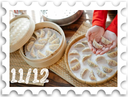 November/December 2024Potluck SWG challenge stamp - several large steamer baskets open to show circular arrangements of dumplings inside; a pair of hands offers a dumpling