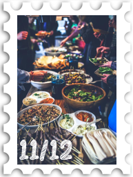 November/December 2024Potluck SWG challenge stamp - a long table set for a feast with many dishes of delicious food