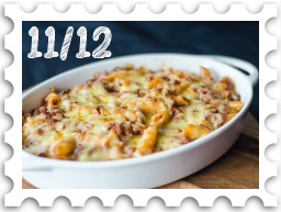 November/December 2024Potluck SWG challenge stamp - a white porcelain baking dish full of baked pasta